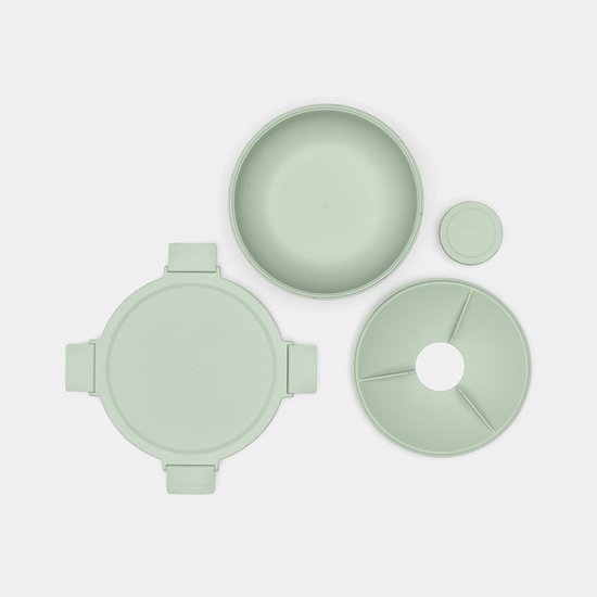 Boîte à salade vert pâle avec couvercle, un diviseur à trois compartiments et un petit pot séparé.