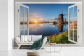 Behang - Fotobehang Doorkijk - Water - Molen - Breedte 360 cm x hoogte 240 cm