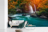 Behang - Fotobehang Watervallen in de herfst in het Nationaal park Na Haew in Thailand - Breedte 600 cm x hoogte 400 cm