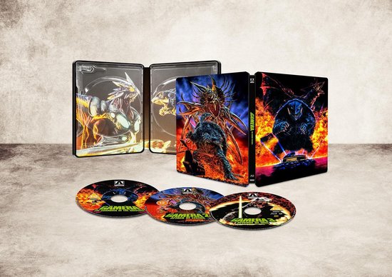 Gamera Heisei Trilogy Steelbook, open met binnenkant en drie Blu-ray discs.