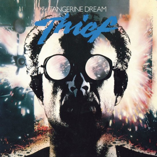 Albumhoes met close-up van een man met bril, TANGERINE DREAM THIEF in blauwe letters.