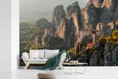 Behang - Fotobehang Zonsopgang bij de Meteora kloosters in Griekenland - Breedte 330 cm x hoogte 220 cm