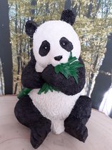 Panda beeld met een tak van Geharo  16x12x11 cm