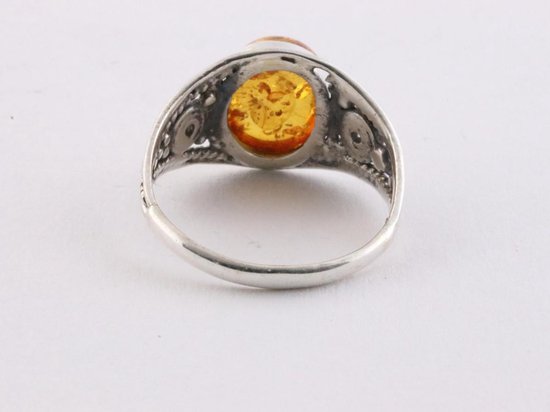 Opengewerkte zilveren ring met amber - maat 18 | bol.com