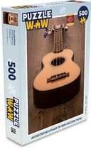 Puzzel Akoestische gitaar op een houten tafel - Legpuzzel - Puzzel 500 stukjes