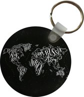 Porte-clés - Wereldkaart - Zwart - Wit- Ciel étoilé - Plastique - Rond - Cadeaux à distribuer