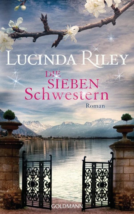 Boek "Die Sieben Schwestern" van Lucinda Riley, met een roman in het midden en een landschap van een meer, bergen en een poort.