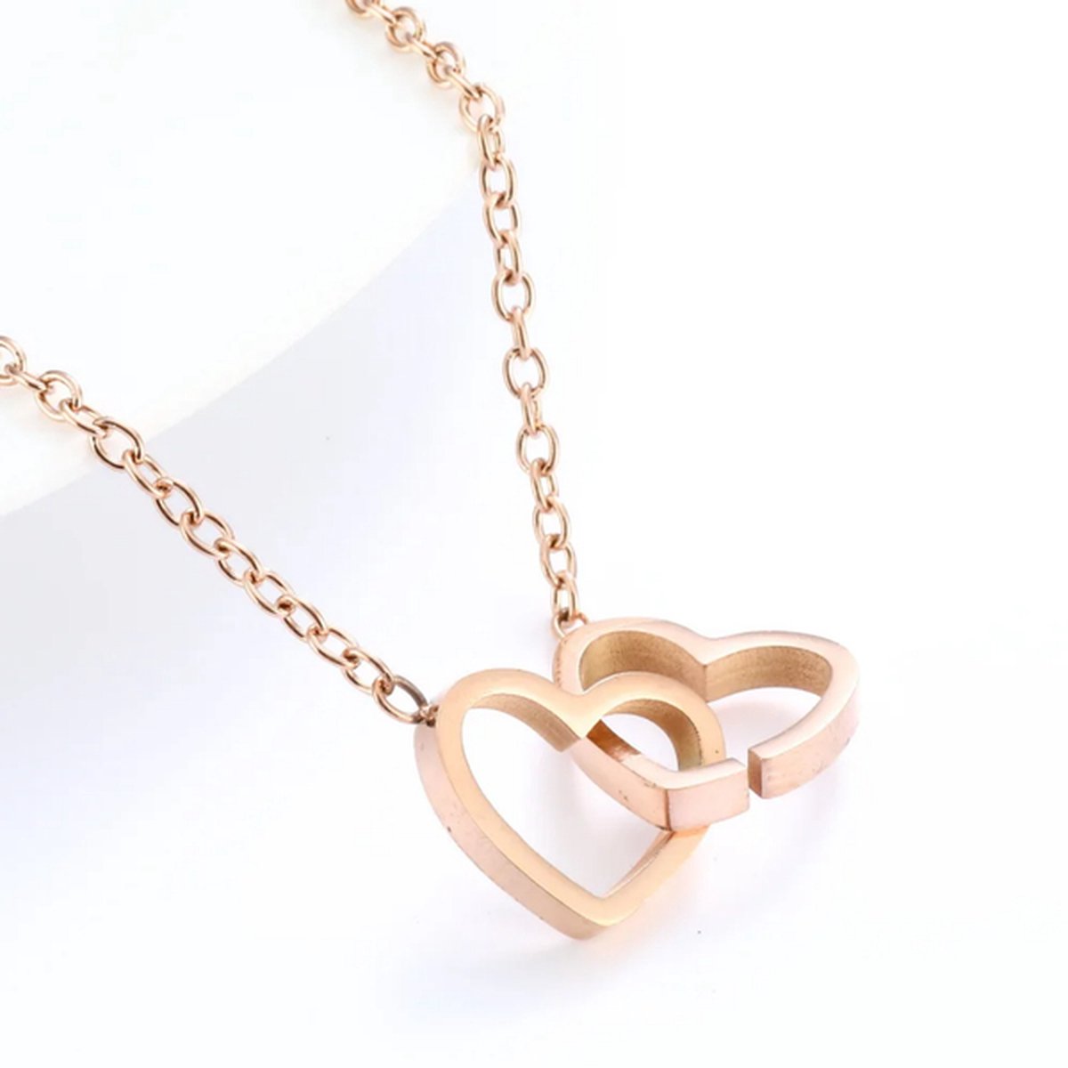 Ketting met hartje - Stainless Steel Rosé Goudkleurig - Waterproof - Glansvast - The Jewellery Salon - Tijdloos & Elegant infinity verbonden
