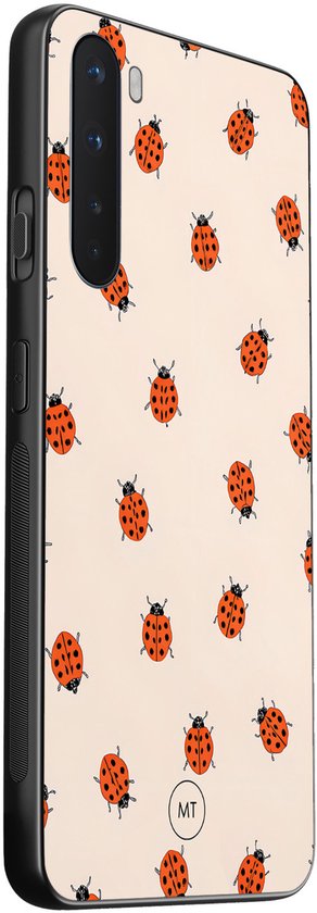 Lichtroze telefoonhoesje met een patroon van lieveheersbeestjes.