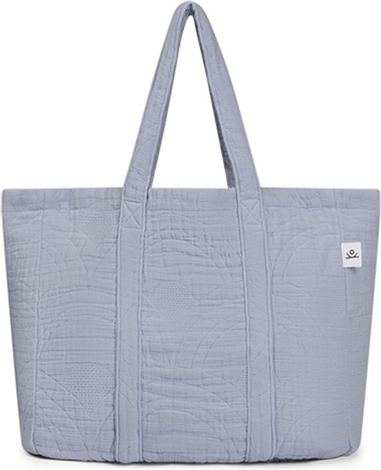 Vue de face du sac lavande matelassé en coton mousseline avec poignées.