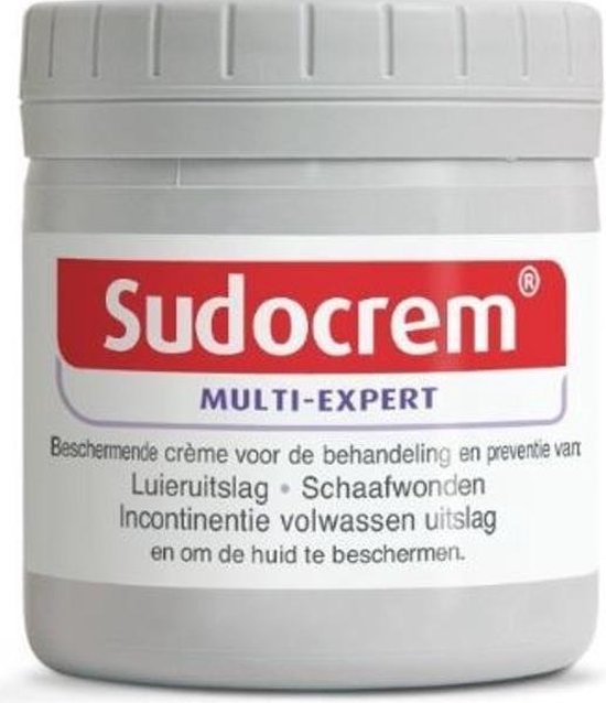 Pot Sudocrem Multi-Expert met witte dop. Het label is wit met rode en paarse tekst, en tekst over luieruitslag, schaafwonden en incontinentie uitslag bij volwassenen.