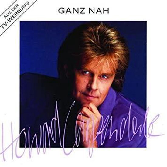 Portret van Howard Carpendale in een paars overhemd voor het album 'Ganz Nah', met tekst 'Uit TV-reclame'.