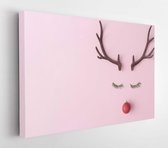 Christmas reindeer concept evergreen fir, red bibon decoration and horns on pastel pink background. The idea of ​​a minimal winter holiday. Flat lay composition top view.  - Modern