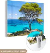 MuchoWow® Glasschilderij 120x90 cm - Schilderij acrylglas - Boom - Zee - Tropisch - Zomer - Foto op glas - Schilderijen