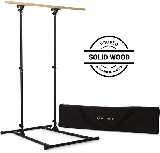 Zwarte pull-up bar met houten sport en een zwarte transporttas. Bevat 'PROVED SOLID WOOD NORTH AMERICAN BEECH' tekst.