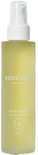 Gele fles met witte pomp, met het label 'BOUCLÈME curls redefined revive 5 hair oil'.