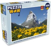 Puzzel De Matterhorn in Zwitserland boven een paardebloemweide - Legpuzzel - Puzzel 500 stukjes