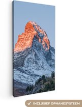 Canvas Schilderij De Matterhorn in Zwitserland bij zonsopkomst - 20x40 cm - Wanddecoratie