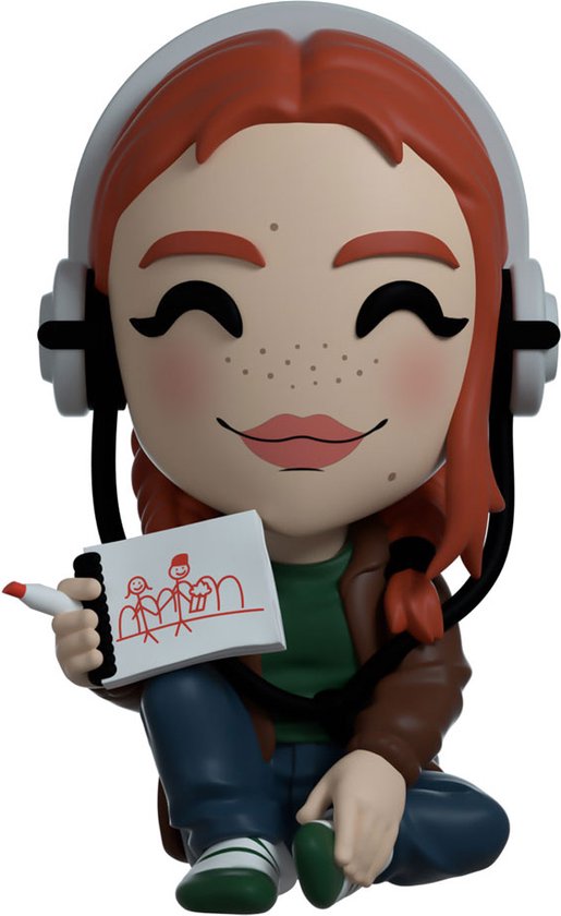 Figurine en vinyle Max Mayfield aux cheveux roux, taches de rousseur, casque, veste et carnet de croquis avec crayon.