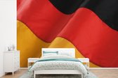 Behang - Fotobehang Golvende Duitse vlag - Breedte 390 cm x hoogte 260 cm