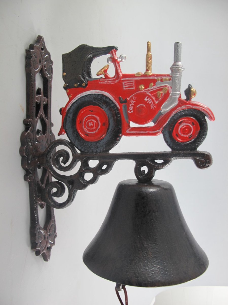 Gietijzeren bel met rode tractor