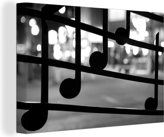 Canvas Schilderij Muzieknoten op venster met op de achtergrond de Beale Street van Memphis in de VS - zwart wit - 120x80 cm - Wanddecoratie