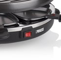 Gedetailleerde close-up van de rode aan/uit-schakelaar van de Princess raclette grill.