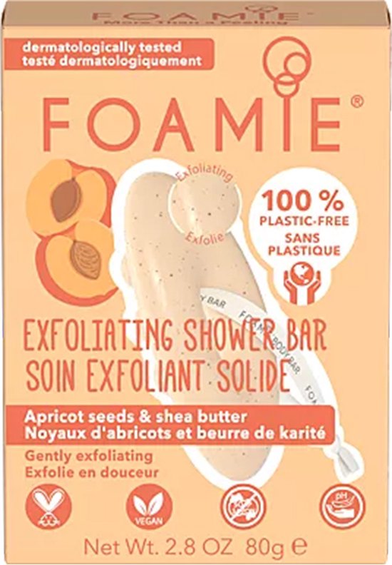 Beige exfoliërende douchebar met puntjes en een lintje. De verpakking toont perziken.