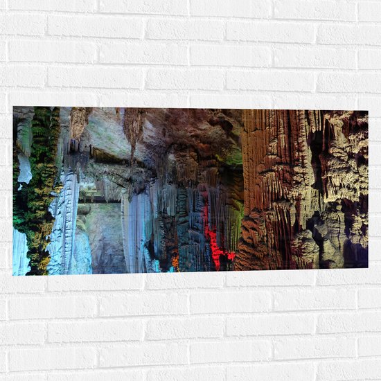 WallClassics - Muursticker - Gekleurde Lampen in een Grot - 100x50 cm Foto op Muursticker