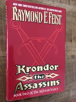 Boek met rode kaft, met goudkleurige letters 'Raymond E. Feist' en 'Krondor the Assassins'. Goudkleurige zwaarden als illustratie.
