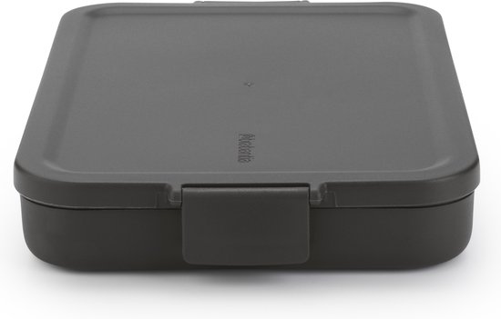 Boîte à lunch Brabantia gris foncé fermée, avec un fermoir à clip.