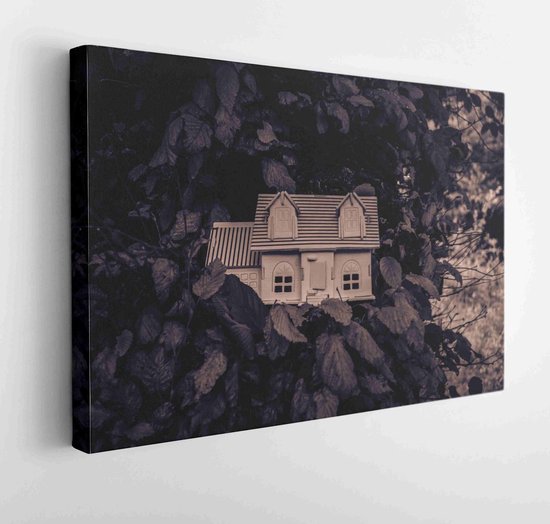 Wooden model of house in the garden. House on tree. Small wooden house in green grass. Selective focus  - Modern Art Canvas - Horizontal - 1109262161 - 115*75 Horizontal