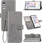 Voor LG Velvet 5G vierbladige sluiting reliëf gesp mobiele telefoon bescherming lederen tas met lanyard & kaartsleuf & portemonnee & beugel functie (grijs)