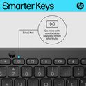 Gros plan sur le clavier HP avec une touche emoji.