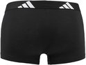 Zwarte boxer met brede, elastische tailleband met wit Adidas-logo aan de zijkant.