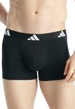 Zwarte boxer met elastische band met witte Adidas logo's.