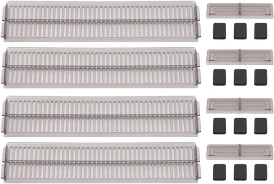 Vier transparant-zwarte plastic ladeverdelers met verticale ribbels en vierkante zwarte anti-slip stickers.