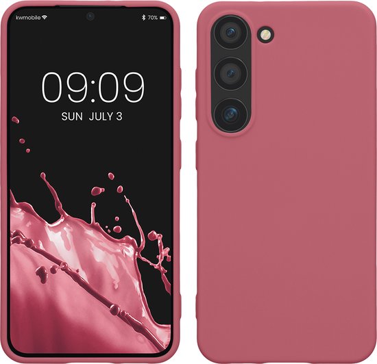 Coque de téléphone rose foncé à côté d'un smartphone avec un fond d'écran éclaboussé de rose.