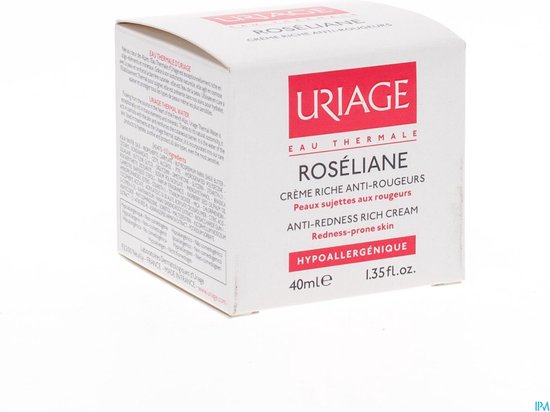 Witte doos met rode en roze tekst, met een pot ernaast.