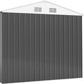 Achterkant van een donkergrijs metalen tuinhuis met witte dakrand en ventilatieopeningen.