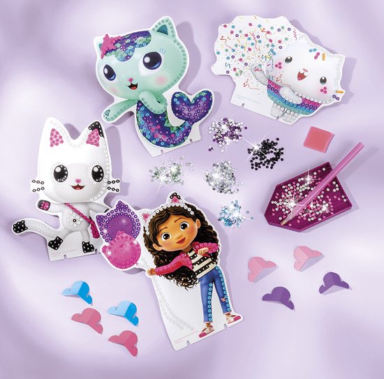 Knutselset met figuren, strass-steentjes, spraypennen en armbandjes.