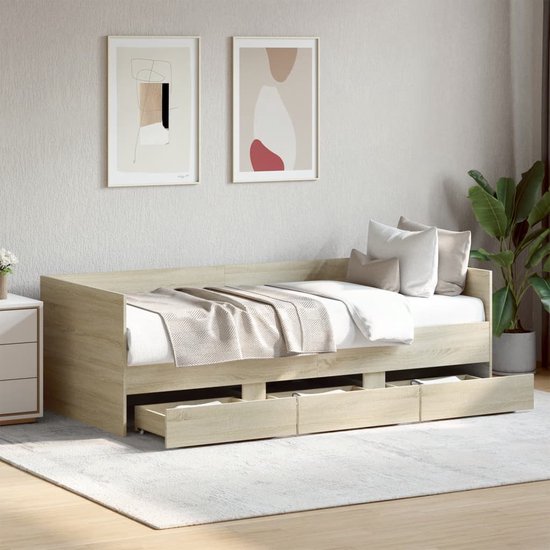 Een slaapkamer met een dagbed in eikenkleur, met open lades en een plant.