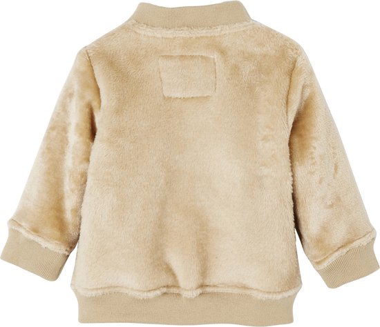 Beige teddyvest met ritssluiting, ronde hals en gebreide boorden. De achterkant heeft een label.