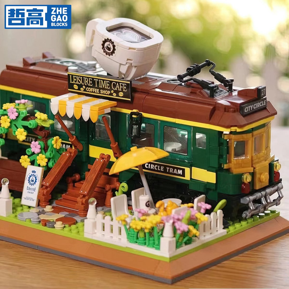 Zhe Gao DZ6002 Classic Trein Café bouwset incl. 4 minifigures | City & friends adventure Modelbouw | Educatief Creator speelgoed bouwpakketten voor kinderen & volwassenen | Bloemen foodtruck niet compatibel met lego | Bouwdoos met 1081 bouwstenen — afbeelding 2