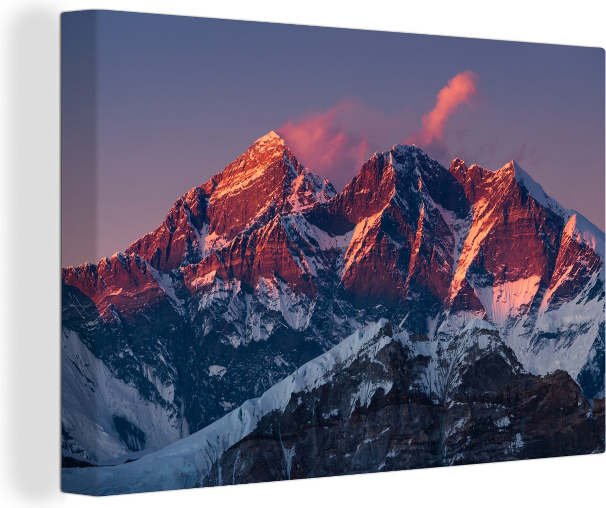 Canvas Schilderij Een afbeelding van een zonsondergang bij de bergen Mount Everest en Nuptse in Nepal - 180x120 cm - Wanddecoratie XXL - OneMillionCanvasses