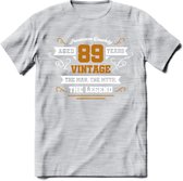 89 Jaar Legend T-Shirt | Goud - Wit | Grappig Verjaardag en Feest Cadeau Shirt | Dames - Heren - Unisex | Tshirt Kleding Kado | - Licht Grijs - Gemaleerd - S
