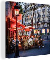 Canvas Schilderij Rood verlicht terras in Parijs in Frankrijk - 90x90 cm - Wanddecoratie