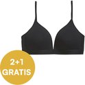 Zwarte beugelvrije bh met elastische band en een gele cirkel met tekst '2+1 GRATIS'.