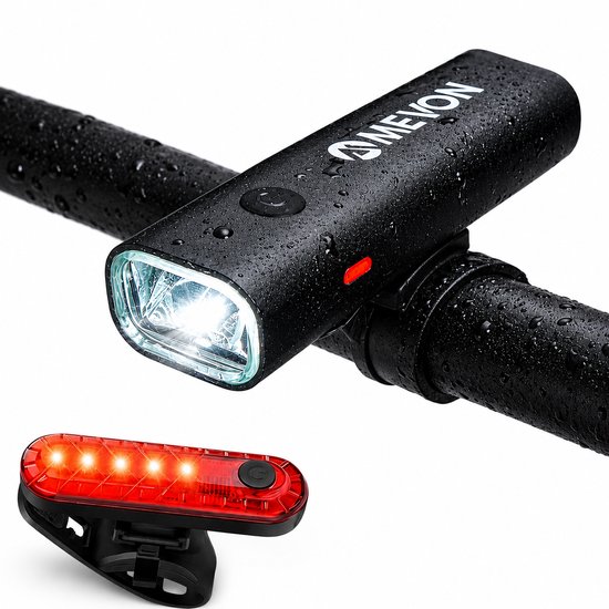 Set d'éclairage de vélo Mevon noir avec feu avant et feu arrière, tous deux mouillés par la pluie.