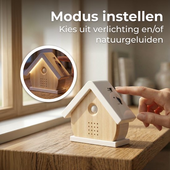 Vinger die een vogelhuisje aanzet, dat zacht licht geeft. Text 'Modus instellen'.